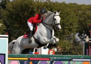 Lorette jumping Call Collect in Albion tack and Woofwear boots